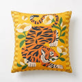 Decorative pillow with a tiger and floral design on a yellow background