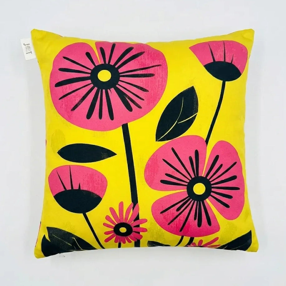 Decorative pillow with pink flowers on a yellow background
